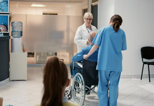 Medical Assistant working at a clinic desk